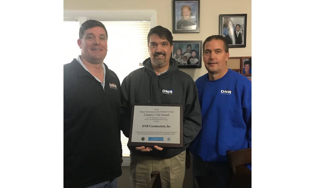 DNR staff holds their contractor of the year award